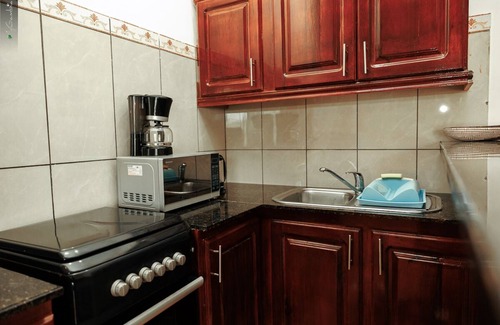 Kotu Apartment | 1 Bedroom Apartments | kitchen | Free Wifi | Daily Cleaning | AC | Cable | Pool