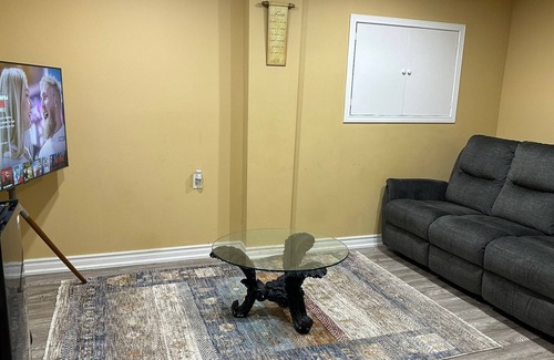 Brampton House | 1 bedroom basement suite with spacious living room and laundry, no kitchen.