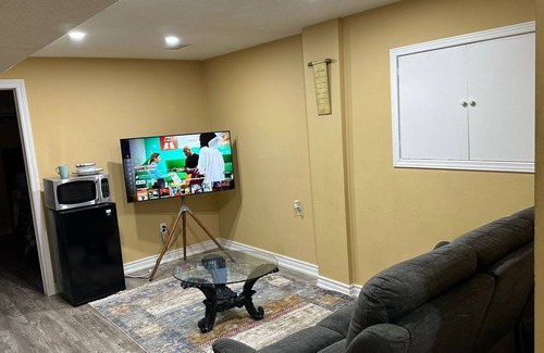 Brampton House | 1 bedroom basement suite with spacious living room and laundry, no kitchen.