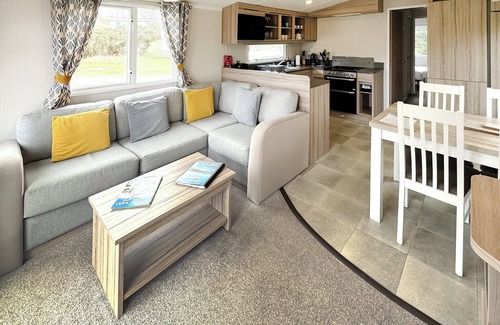 Castle Douglas House | 12ft-wide caravan situated in a coastal position.