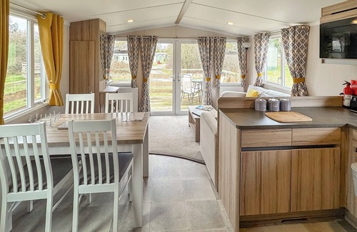 Castle Douglas House | 12ft-wide caravan situated in a coastal position.