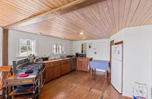 North House | 1899 Old Log Cabin School House w/10 acres on the Chesapeake Bay with Beach