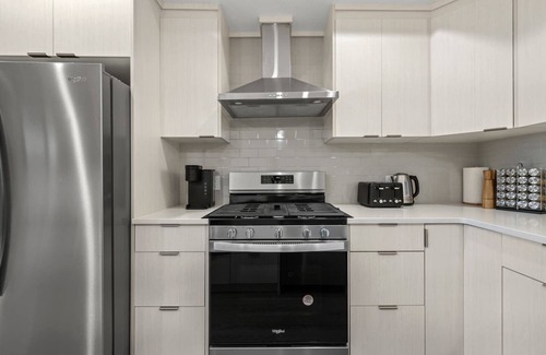 Sage Hill Apartment | 1BR Walk Out Suite » Backyard » Patio » 65” TV