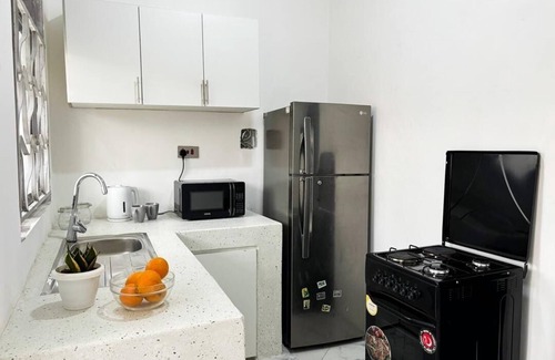 Entebbe House | 2 Bedroom Apartment w/Palm View Balcony Ensuite Bathrooms Entebbe