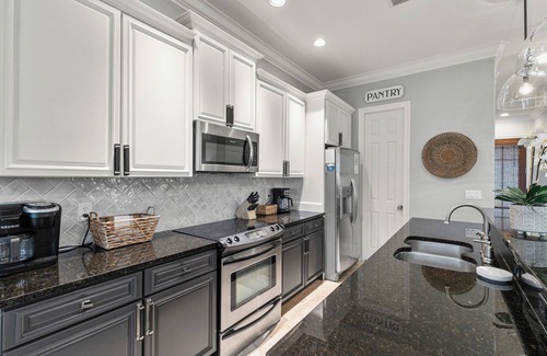 Villa Lago House | 3BR Beach Villa with 2- GOLF CARTS! Steps from Pool! Near Wharf. Beach Tram.