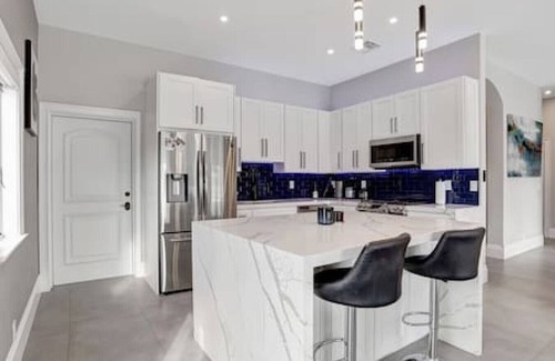 South New River Isles House | 3BR Waterfront Villa with Heated Pool, Spa, & Rooftop Deck