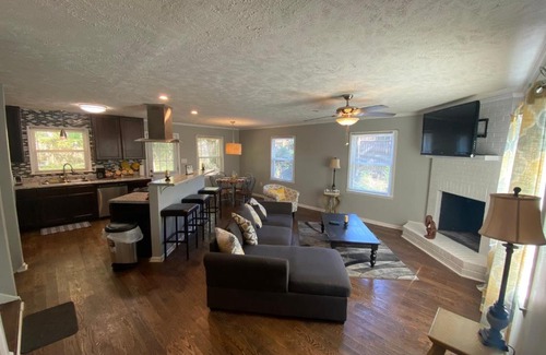 Terry Sanford House | 4-bedroom brick home with a full kitchen, king size bed and all the space you need for you and your large family on your getaway.
