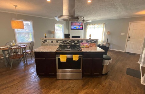 Terry Sanford House | 4-bedroom brick home with a full kitchen, king size bed and all the space you need for you and your large family on your getaway.