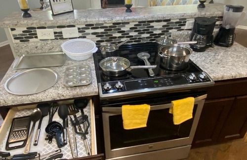 Terry Sanford House | 4-bedroom brick home with a full kitchen, king size bed and all the space you need for you and your large family on your getaway.