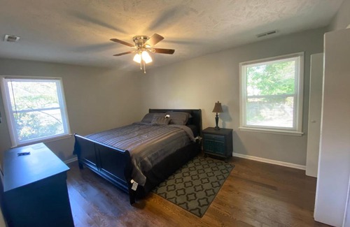 Terry Sanford House | 4-bedroom brick home with a full kitchen, king size bed and all the space you need for you and your large family on your getaway.