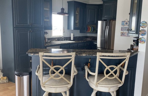 Cocodrie House | 4 floor costal home - large outdoor entertainment & cooking area - pool splash