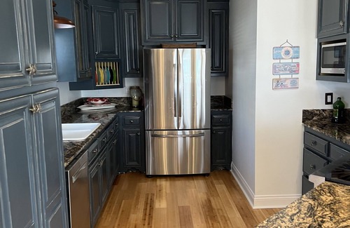 Cocodrie House | 4 floor costal home - large outdoor entertainment & cooking area - pool splash