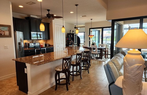 South Gulf Cove House | A 100+ reviews Family friendly home on canal with gulf access and heated pool!