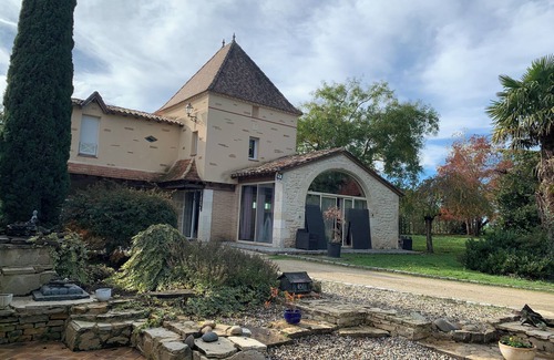 Montpouillan House | A bucolic stone estate with a cascading pool.