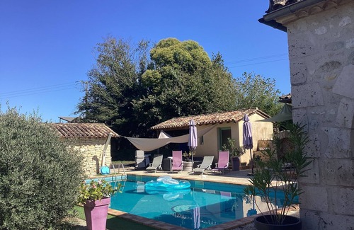 Montpouillan House | A bucolic stone estate with a cascading pool.