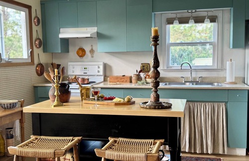 Cap-Pele Ski Chalet | A cottage among the trees, a cape, a beach.
