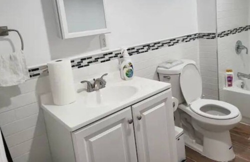 Weequahic Apartment | A cozy basement with queen-size beds Free WiFi, and a Smart TV with Roku.