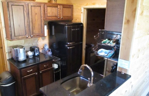Carbon Hill Cabin | A cozy new cabin in rural setting with a hot tub on porch. Beautiful rural view.