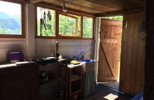 Villa Minozzo Cabin | A cute colourful Glamping cabin with a bohemian theme.