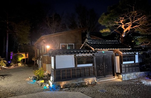 Matsukawa Cottage | A detached room with a cypress bath overlooking the garden and a large deck/Kitaazumigun Nagano