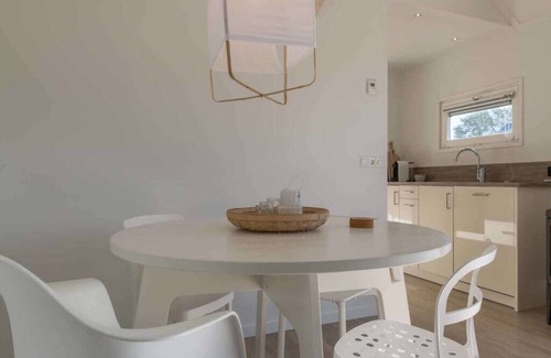 Westenschouwen House | A glass of wine by the gas stove, a board game at the round dining table or a captivating book in th