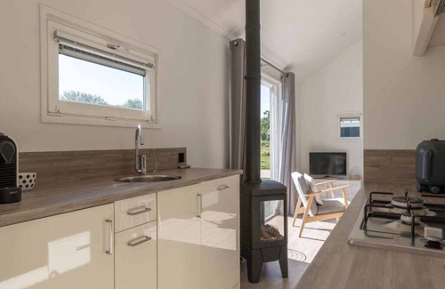 Westenschouwen House | A glass of wine by the gas stove, a board game at the round dining table or a captivating book in th