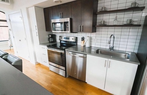 Downtown Omaha Apartment | A historic beautifully detailed suite, 1,300 square foot, corner loft in the heart of the Old Market