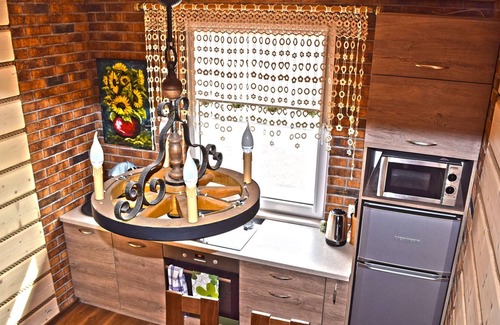 Lubna House | A luxury home on the shore of the lake. Living room with fireplace, 2 bedrooms.