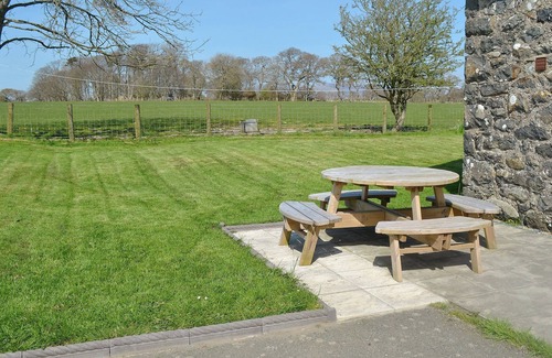 Llanystumdwy Cottage | A spacious detached property with an open fire and enclosed garden.