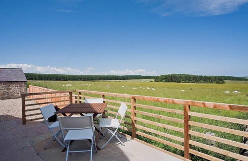 Wandylaw Cottage | A stylish cottage with rural views towards the coastline from the patio.