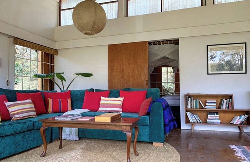 Naivasha House | A unique, eco-friendly hideaway with walls that open to the savannah, allowing safari wildlife viewing from the comfort of the living room.
