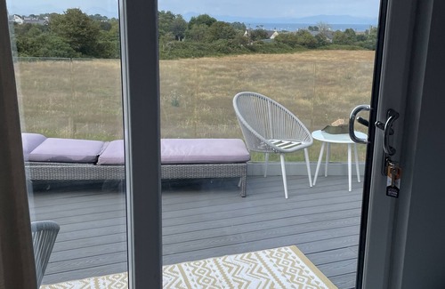 Abersoch Apartment | Abersoch studio with a decking area with amazing views.