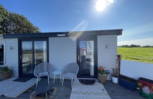 Abersoch Apartment | Abersoch studio with a decking area with amazing views.
