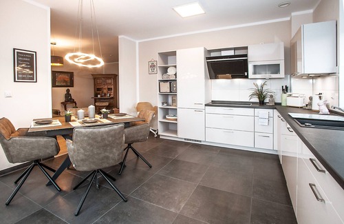 Grasberg Apartment | Above the Rooftops of Grasberg's City