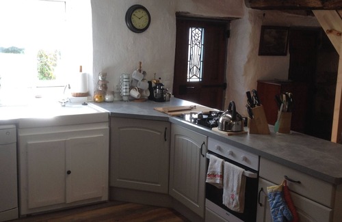 Saint-Nicolas des Eaux House | Adorable Breton Cottage with thatched roof and stone walls.