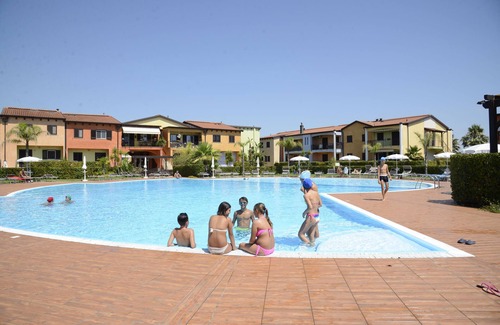 Lido Condo | AFRODITE-Elegant villa overlooking pool.