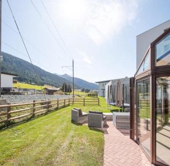 Davos Apartment | Agrimonia - 5,5-Zi Duplex Wohnung bis 11 Personen mit eigenem Garten