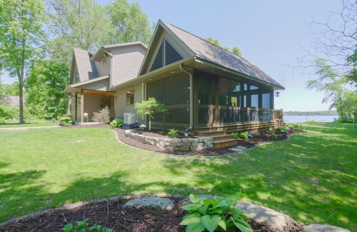 Alexandria Cabin | Amazing lake home on level lot with loft above garage paddle boat