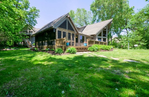 Alexandria Cabin | Amazing lake home on level lot with loft above garage paddle boat