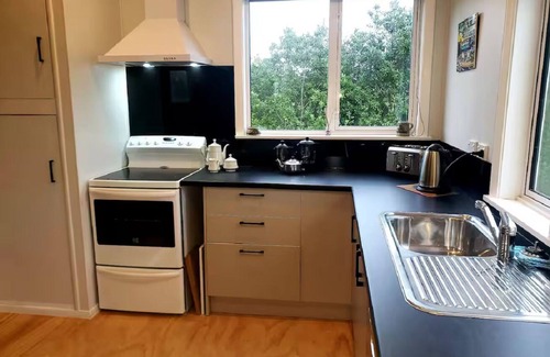 Lake Ferry Cottage | Amazing recently renovated cozy cottage, oozing both character and comfort.