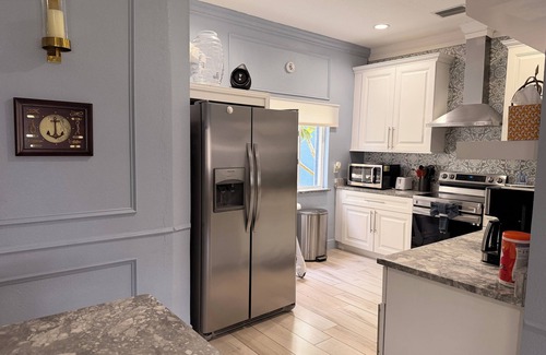 Greater Palm River Point CDC House | Amazing waterfront vacation home in Tampa -Gated, Heated pool