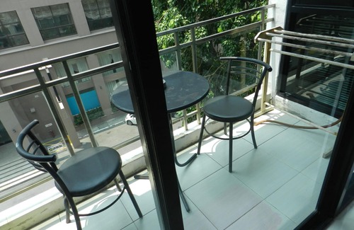 Jomtien Apartment | Apartment bedroom + living room.