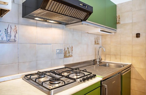 Calceranica al Lago Apartment | Apartment 'Garden Alle Barche - Marina 7' with Lake View, Shared Garden and Wi-Fi