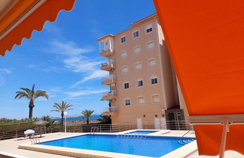 Punta Prima Apartment | Apartment with 2 bedrooms, Wi-Fi, air conditioning, sea view, pool, and garage