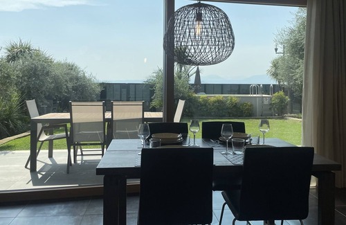 Cisano Apartment | Apartment with direct access to the lake. Garden and private pool!