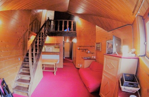 Cervinia Apartment | apartment with mezzanine and fireplace