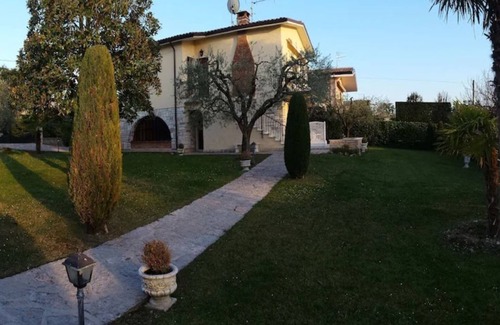 Bardolino Apartment | Apartment with sun terrace, large garden, communal pool, bathroom and guest WC