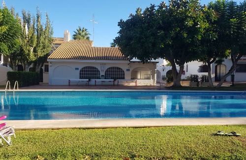 Coveta Fuma Apartment | Apt in lush gardens, large pool, steps from the sea, stroll to Campello beach