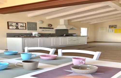 Ponti sul Mincio Apartment | Attic lake view immersed in the Morenic hills