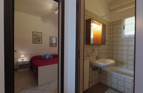Susello Apartment | Attractive 2-room apartment with sunbath, pool and dream view